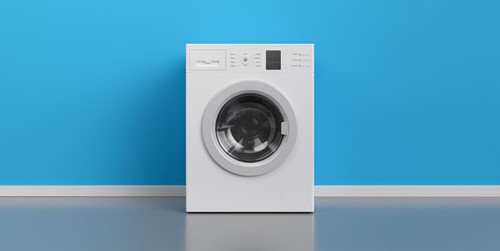 Washing Machine At Blue Wall Frontal View With Copy Royalty Free Image 1096523200 1564593294